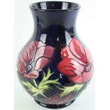 A large modern Moorcroft vase Of baluster form, decorated in the 'Anemone' pattern on a blue ground,