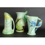 Three Burleigh ware jugs To include Budgie handle, height 20cm, floral jug, height 23cm,