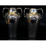 A pair of Art Nouveau Kayser silver-plated twin handled vases Each having a single band of embossed