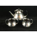 An Elkington silver-plated three piece tea service Designed by Eric Clements, comprising teapot,