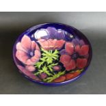A large modern Moorcroft bowl of circular form Decorated in the 'Anemone' pattern,