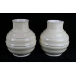 A pair of Wedgwood glazed football vases By Keith Murray, shape number 4196,