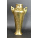 A large WMF Art Nouveau brass twin handled vase Having embossed stylised floral decoration,