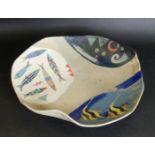 A studio pottery circular bowl With wavy rim,