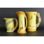 Three Burgess & Leigh Burleigh ware jugs To include example with Butterfly handle, height 20cm,