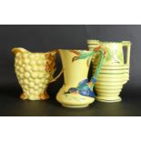 Three Burleigh ware jugs To include a Bluebird example, height 19cm,