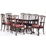 A Chippendale style twin pedestal table and eight conforming chairs,