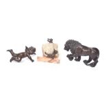 A group of collectable bronze items To include a standing lion, with one foot raised on a ball,