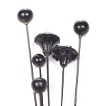 A collection of Whitby Jet style hat pins To include four ball examples,