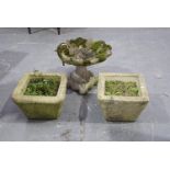 A group of reconstituted stone garden ornaments To include a rococo shell form bird bath,