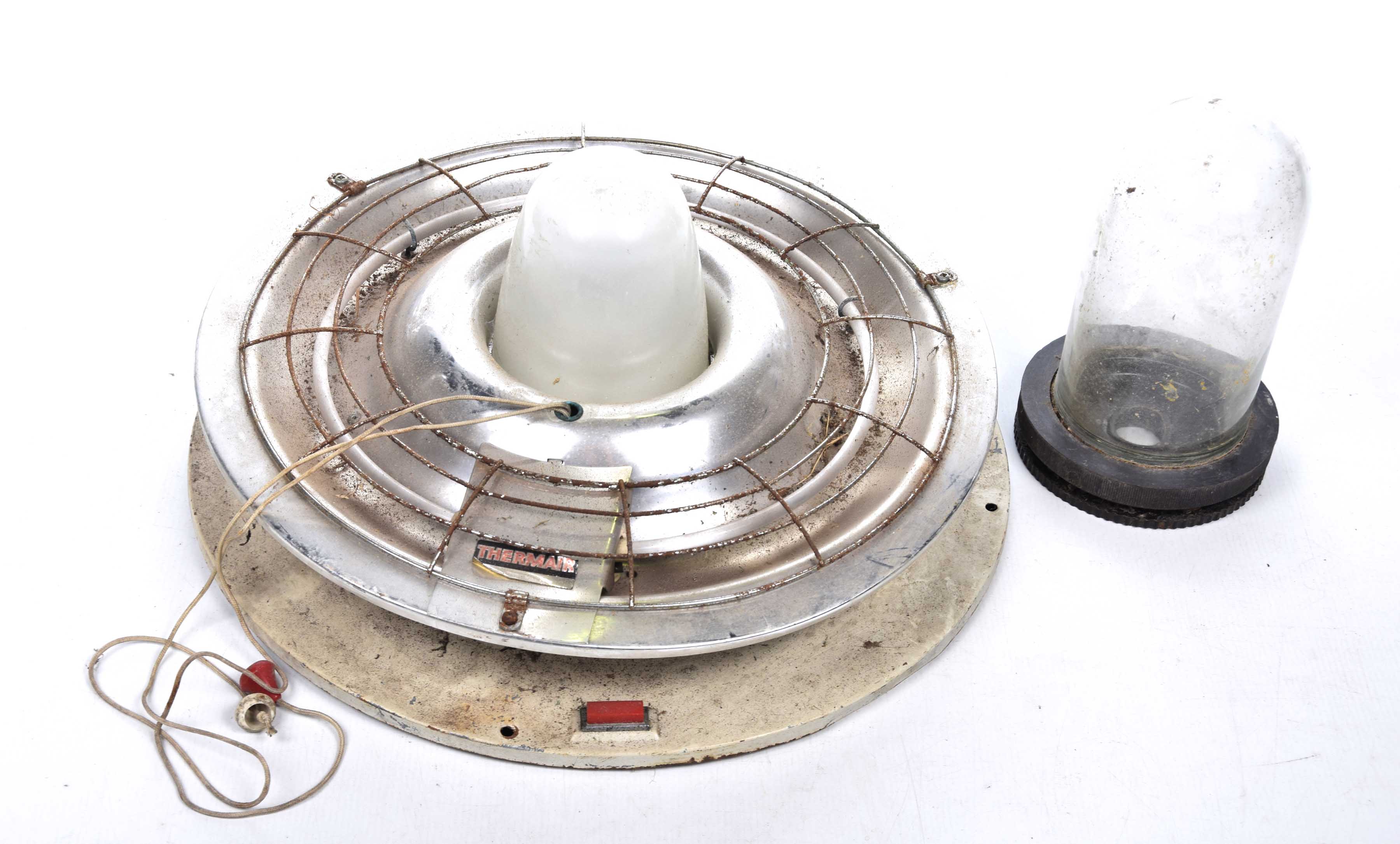A vintage industrial bulkhead style ceiling light The metal chromed light with exterior cage and