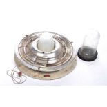 A vintage industrial bulkhead style ceiling light The metal chromed light with exterior cage and