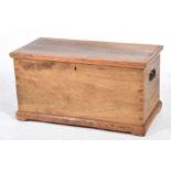 A Victorian fruit wood blanked chest With iron side swing handles and a fitted interior candle box,