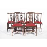 A set of six Chippendale style oak dining chairs,