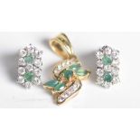 A simulated emerald and simulated diamond pendant Set to recious yellow metal, together with,