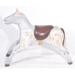 A vintage early to mid 20th Century painted wooden fairground horse The carved and painted wooden