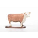 A Beswick figure "CM of Champions" cow figure The matt glazed figure typically modelled in standing