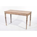 A scumbled and stained hardwood kitchen table The rectangular moulded top with rounded corners
