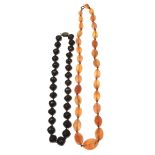 A garnet bead necklace Composed of uniform faceted beads to a white metal clasp, length 38.