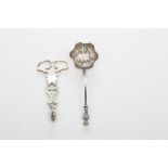 A pair of Georgian Silver sugar tongs, Circa 1760 Each of ornate scroll form with shell form rips,