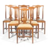 A set of six early 20th Century mahogany dining chairs Each with a pierced splat above drop in
