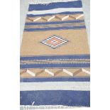 A Turkish Kilim style rug The flat woven rectangular form rug detailed with banded and transverse