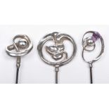 A collection of three Edwardian Charles Horner Silver hat pins All of similar scrolling art nouveau