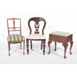 An Edwardian mahogany piano stool With a padded drop in seat raised on cabriole legs and pad feet,