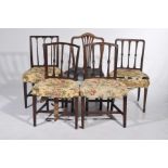 A matched set of four Sheraton style mahogany dining chairs and one other The chairs each with
