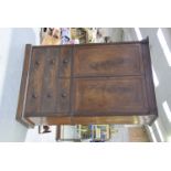 An early 19th Century mahogany linen press With a cavetto cornice above cupboard doors each inlaid