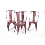 A set of four industrial type painted metal stacking cafe chairs Each chair with a tapering splat