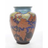 A Dutch Gouda vase Of ovoid form with Autumnal designs of brown and umber leaves reserved against