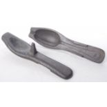 A 19th Century style cast iron spoon mould Formed of two sections, 20cm long.