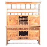 A rare and attractive French cherry wood kitchen dresser The raised back with a moulded cornice