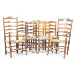 A matched set of seven 18th/19th Century oak and ash country chairs Each with a rung back over an