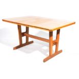 An early 20th Century light oak Arts and Crafts dining table The rectangular top with canted
