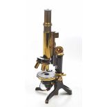 A late 19th/early 20th Century Swift & Sons binocular microscope The brass and black painted