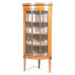 A mid 19th Century Biedermeier birch freestanding corner display cabinet With a plain frieze above