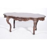 A 19th Century rosewood centre table The shaped oval top above a single frieze drawer raised upon
