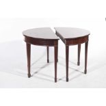 A pair of 19th Century mahogany D end tables Each with a bowfront top above a plain frieze raised