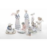 A collection of Lladro and Nao figures To include seven Lladro examples depicting ladies in