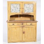 A late 19th Century stained and scumbled hardwood kitchen dresser The upper section with a pair of