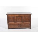 An 18th Century and later oak blanket chest The hinged moulded three plank top enclosing a fitted