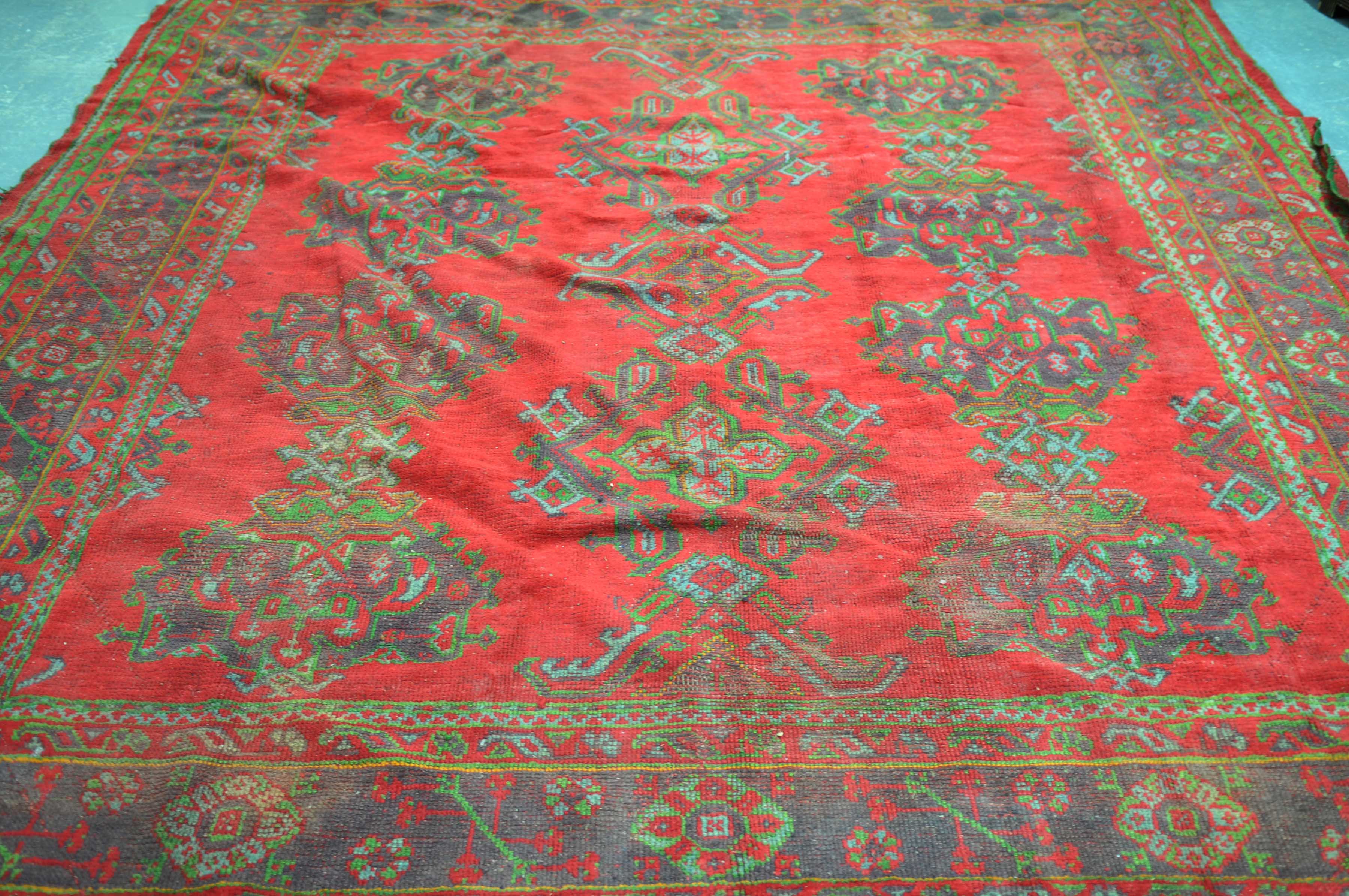 A Turkish Bokhara red ground rug The central reserve filled with a series of twelve abstract design