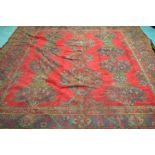 A Turkish Bokhara red ground rug The central reserve filled with a series of twelve abstract design