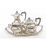 A George V Silver four piece tea service Each of fluted design with domed top and look handles,