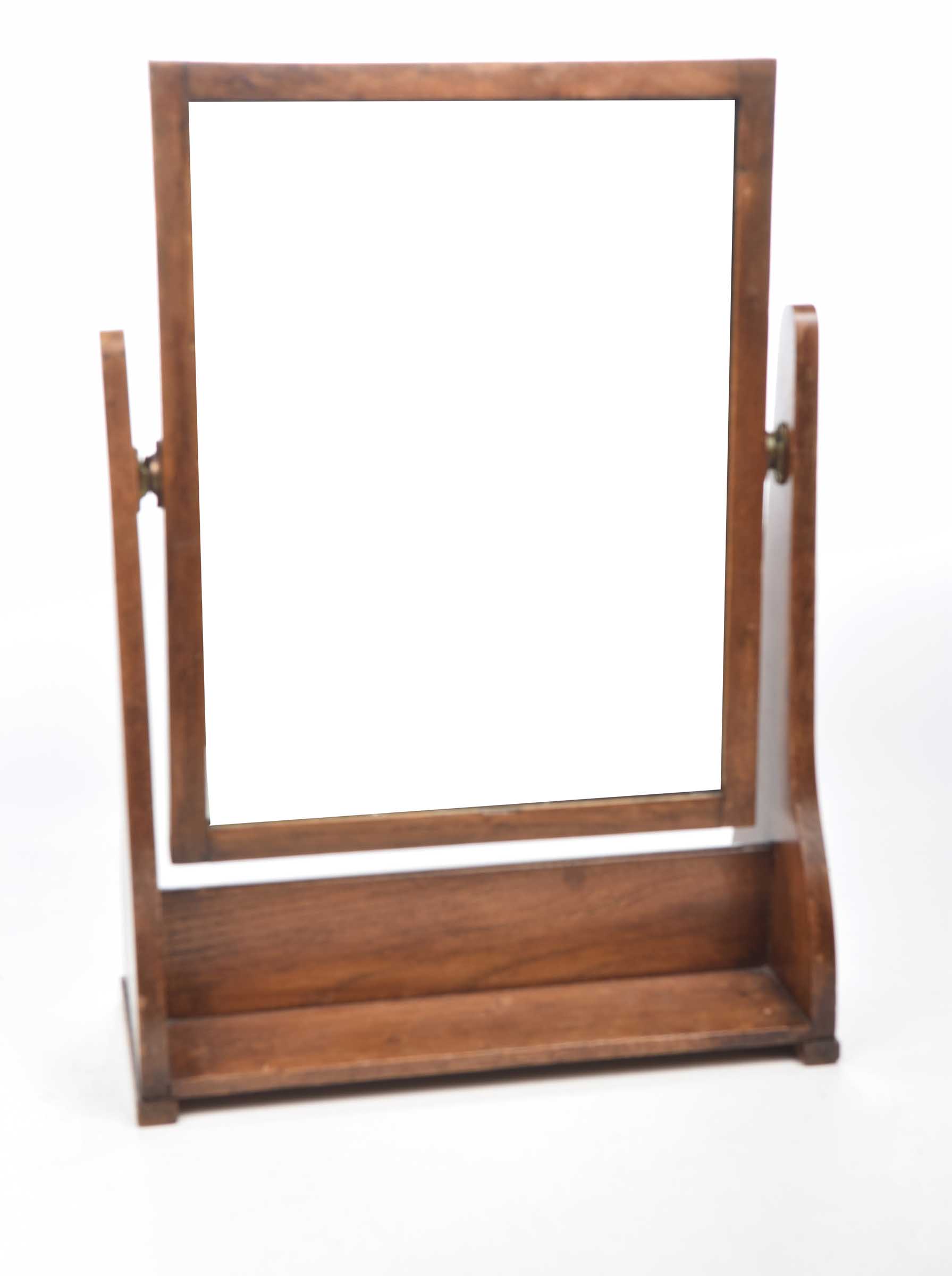 An Art and Crafts oak framed swing toilet mirror Stamped George VI to base,