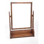 An Art and Crafts oak framed swing toilet mirror Stamped George VI to base,