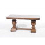 A 20th Century refectory style oak coffee table The rectangular moulded top supported on two