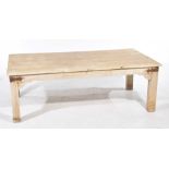 A rustic hardwood coffee table The five plank top supported on legs of square section and applied